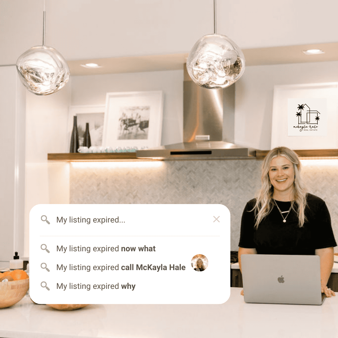 A smiling person stands behind a counter with a laptop, under spherical pendant lights, in a modern kitchen setting. A real estate-related search prompt is visible.